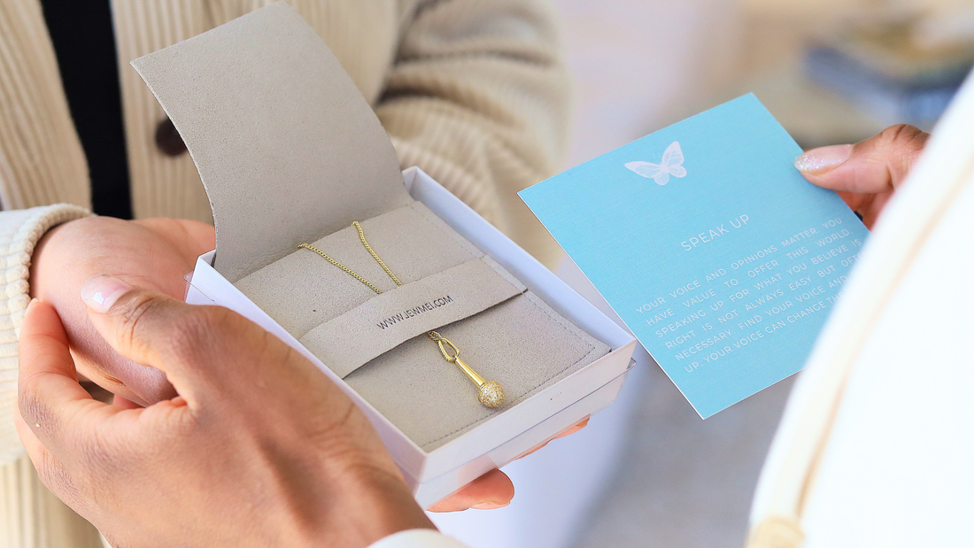 Image of two women holding a Jewmei Jewelry box and Meaningful Keepsake card