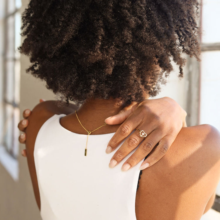 Woman wearing 'God is within her' Cross Ring - Symbolic Religious Jewelry for Women of Faith.