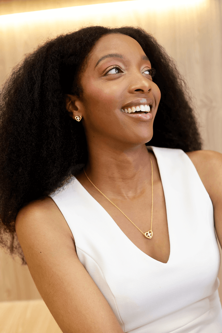Woman wearing Jewmei Heart Cross Stud Earrings