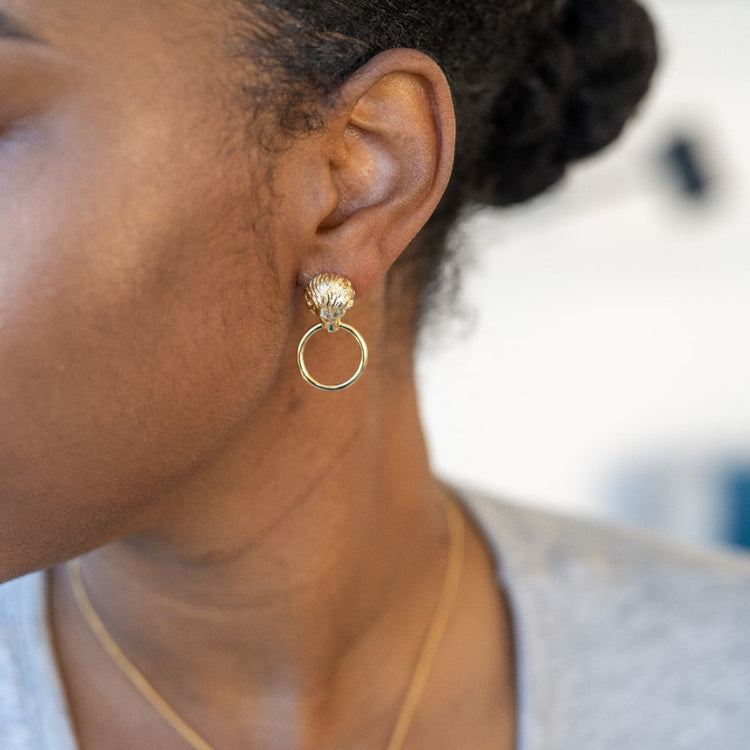 Woman wearing a pair of Lion Earrings