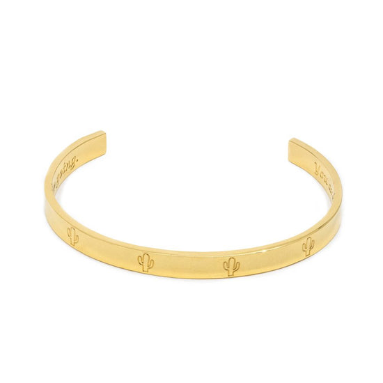 Jewmei  perseverance gold cuff bracelet with cactus symbol representing perseverance. 